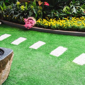 artificial grass in natural lawn