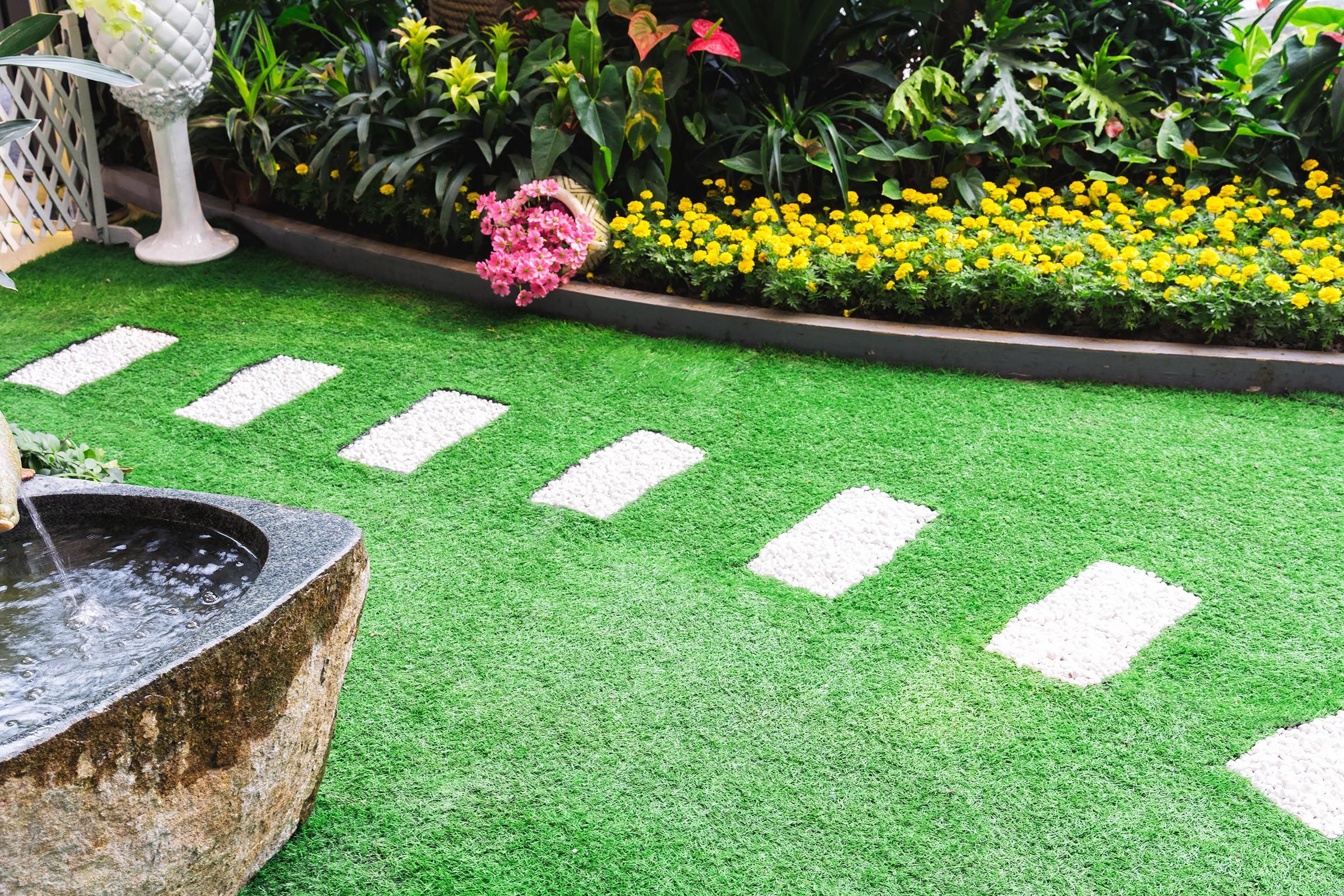 artificial grass in natural lawn